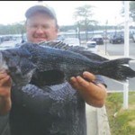 Catch of the Week! Kenny F showing off  a nice seabass. *photo submitted