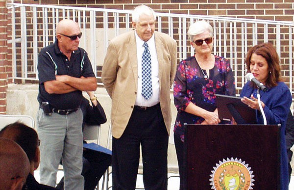 The children of George Otlowski Sr. -- Matthew & George Otlowski Jr. and Kathy Totin -- are presented with a proclamation by Mayor Wilda Diaz