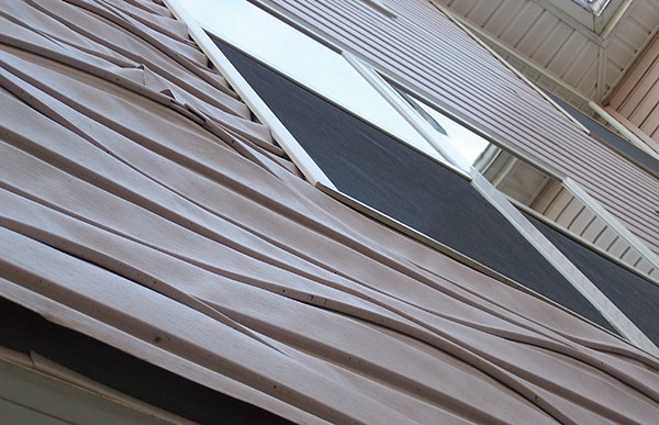 Harbortown photo in the 7/17/13 Amboy Guardian. At the 12/11/13 Council Meeting, Councilman Bill Petrick was concerned about the temperature that caused the vinyl to melt. “This could be a safety hazard and the windows were not supported with adequate materials.”