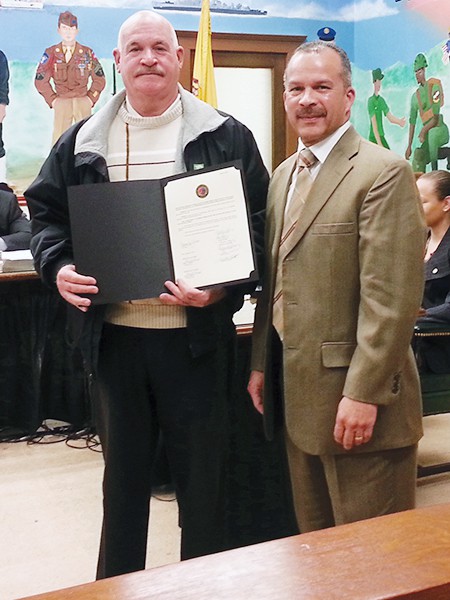 Former Commissioner Honored – Council President Joel Pabon presented Peter Perez with a Proclamation on behalf of the City of Perth Amboy for his 20+ years of dedicated service as a Housing Authority Commissioner. Photo by Carolyn Maxwell