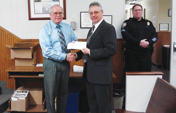 SOUTH AMBOY - Gerald Ricciardi, Area Manager for JCP&L Community and Customer Relations presents Mayor Fred Henry with a check to be spent on South Amboy’s annual St. Patrick’s Day Parade. *Photo by Mariyah Wojcik