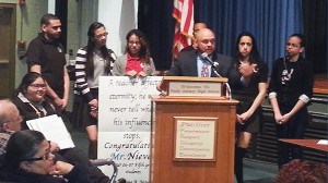 Newly-elected Richardson School Principal Edwin Nieves stands with students who approve of his appointment.