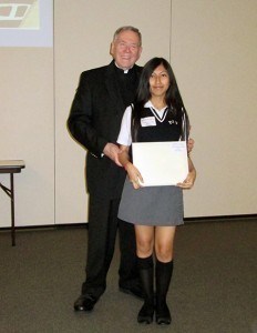 Katherine Zevallos receiving award from Rev. Msgr. Richard A. Behl. * Photo Submitted