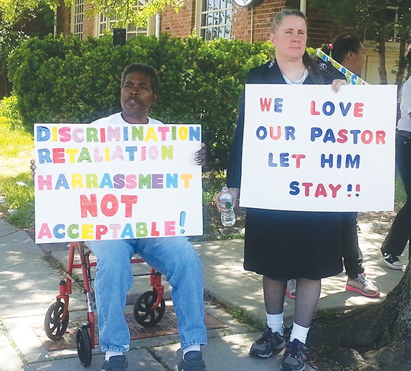 Supporters of Perth Amboy Salvation Army Pastor Jose Santiago protest his impending transfer.
