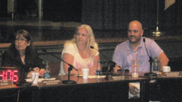PERTH AMBOY - Board Members Maria Garcia and William Ortiz listen as Board President Obi Gonzalez states both Garcia and Ortiz violated By-Laws 0.421. *Photo by Katherine Massopust