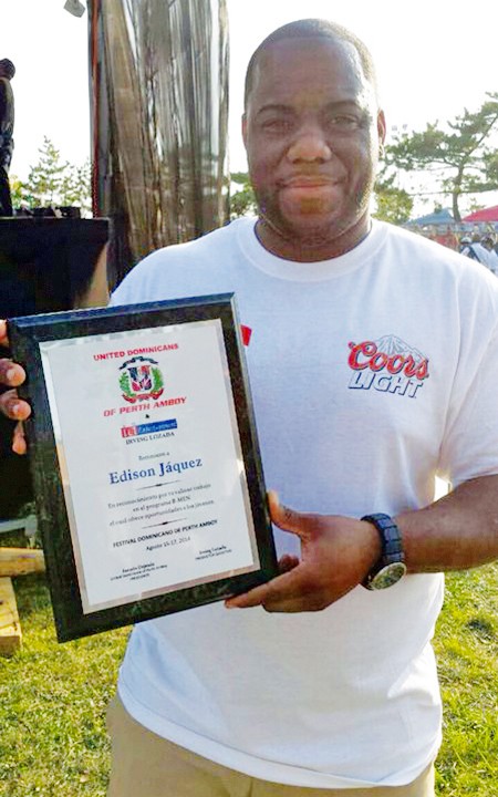 Man holding plaque