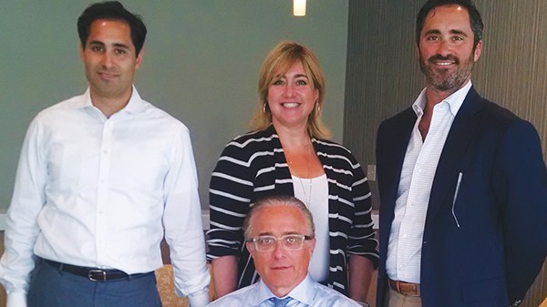 SOUTH AMBOY - Windsor Healthcare Vice-Presidents and Siblings: Joshua Jacobs, Batsheva Katz, Michael Jacobs stand behind their father, President and CEO of Windsor Healthcare Hyman Jacobs