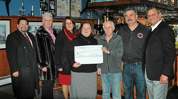 Some present at the re-opening of the Barge in January 2013 were Council Members Kenny Gonzalez, Lisa Nanton and Far Right BID Chair Barry Rosengarten. They were there to help BID Chair Rosengarten present a check to Callie Vosinas (Center), George Nickolas and Alex Vosinas. Callie is the daughter of George and the wife of Alex who own the Barge. *File Photos by Paul W. Wang