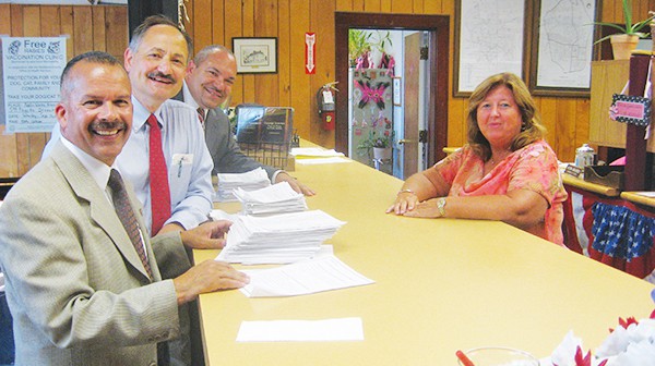 Council Candidates Joel Pabon, Bill Petrick and Sergio Diaz hand in their petitions to City Clerk Elaine Jasko. Pabon & Petrick are seeking re-election, while Diaz seeks a seat for the first time. *Photos by Katherine Massopust