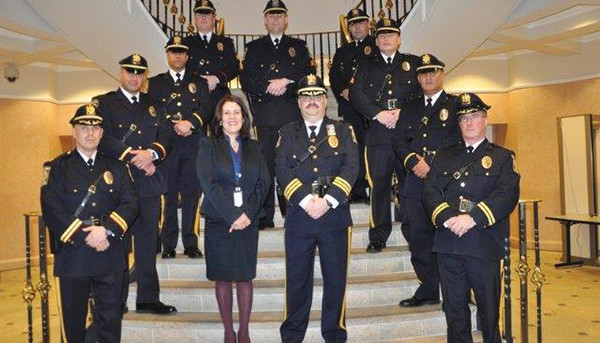 PERTH AMBOY - Pictured above (Center) Mayor Wilda Diaz and Acting Deputy Chief of Police Larry Cattano are surrounded by the newly promoted officers in the Perth Amboy Police Department.