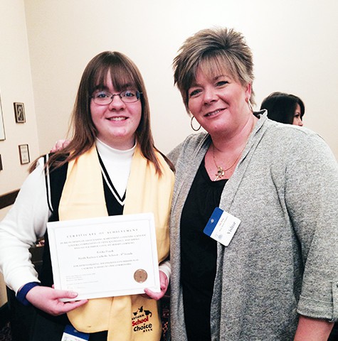 Press Release PERTH AMBOY - Perth Amboy Catholic School student Trisha Ponik, in the 8th grade, was honored at the Trenton State House of New Jersey on January 29th, 2015. Her winning poster was in recognition of Outstanding Achievement conveying Catholic Schools as Communities of Faith, Knowledge and Service. Ms. Ponik’s poster featured the students of Perth Amboy Catholic School, doing community service and public good in the city of Perth Amboy and demonstrating the priceless contribution of Catholic Schools in the community. Photo: left, Trisha Ponik, right Mrs. Patti Ann Ponik, mother of student.