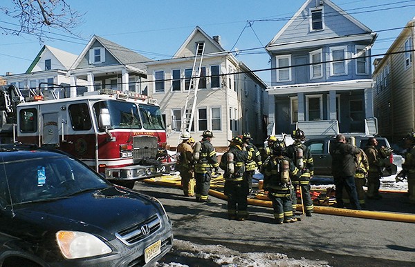 By: Joe Bayona PERTH AMBOY - There was a report of heavy smoke at 162 Brighton Ave. in the early afternoon. According to Fire Chief Abraham Pitre when the Fire Department first rolled up on the scene, flames were coming through the roof. There was a report of a person trapped inside. Upon entry, the Fire Department did a search and found no one and knocked the fire down in ten minutes. There were no injuries. Fire Departments from Perth Amboy, Hopelawn, South Amboy and Woodbridge responded. Fire Departments from Sayreville and Keasbey were on stand-by. There was approximately a total of 25 Firefighters at the scene.