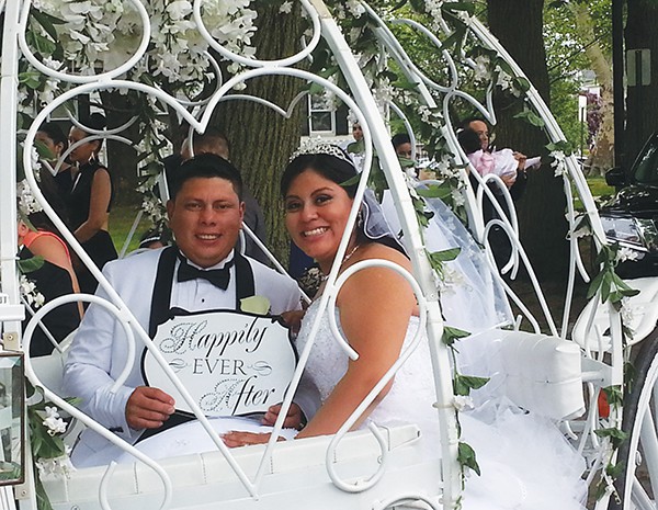 PERTH AMBOY - Newlyweds Karen & Danilo Lopez pose for a photo after exchanging marriage vows. The couple were married on Saturday, May 16, 2015 at the First Presbyterian Church, Perth Amboy. They took a horse drawn Cinderella themed Carriage ride around City Hall Circle on their way to their wedding reception. Congratulations to the happy couple.