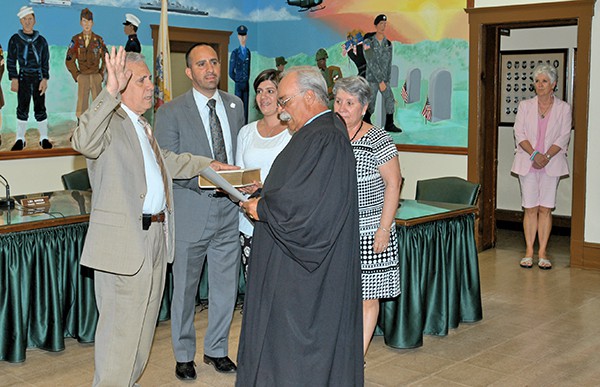 PERTH AMBOY – Before the 5/27/15 Caucus Meeting began, Fernando Gonzalez was sworn in by Judge Mathias Rodriguez. None of the other Council Members were present except for Council President Lisa Nanton who stood outside in the hall leading into the Council Chambers. In attendance were wife, Obi Gonzalez, son and Campaign Manager, Daniel Gonzalez and daughter Marisol Gonzalez. *Photos by Paul W. Wang