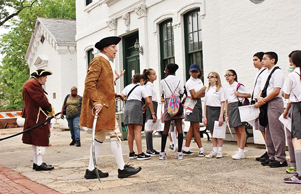 Anton Massopust (as a Revolutionary soldier) informs students about Perth Amboy being the Colonial Capital of New Jersey. John Dyke portrays William Dunlap.