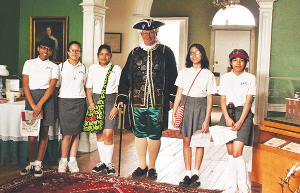Kurt Epps as Royal Governor William Franklin & Perth Amboy Catholic School students in the center hall of the Proprietary House.