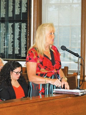 Susan Batista reads a statement at the public portion of the 8/10/15 City Council Meeting *Photo by Paul W. Wang