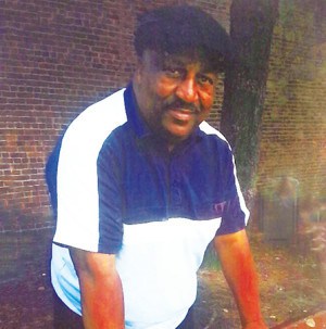 Phillip Willis Photo in the Window of Gomez Dry Cleaners