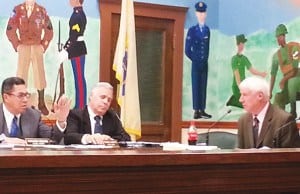 Councilman Fernando Irizarry and Councilman Fernando Gonzalez confer with the new Interim Buisniess Administrator Peter Pelissier