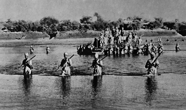 Indian troops in World War II cross the Atbara river with their motor transport on a pontoon raft, as they move into Italian occupied Eritrea. ww2today.com
