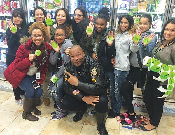 PERTH AMBOY - On December 18, 2015 Youth Alliance, a youth group sponsored by the Perth Amboy Municipal Alliance, participated in their annual Sticker Shock Campaign accompanied by Officer Henry Rodgers. Members entered three local liquor facilities to tag multiple boxes of beer and wine coolers, with bright neon green stickers asking buyers to “Keep it Legal/ Que Sea Legal”. Sticker Shock brings awareness towards underage drinking, reminding buyers that serving minors is illegal. Serving alcohol to minors is known as a disorderly person’s offense which includes up to six (6) months in the county jail, up to a $1,000.00 fine, and a permanent criminal charge on your record if convicted. Youth Alliance would like to thank Gast Wine & Liquors, Liquor T&A, and Ali’s Liquor Warehouse for participating in our campaign.
