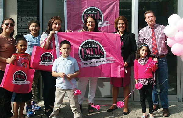 Press Release PERTH AMBOY - The Downtown Business Improvement District (BID) and Meridian Healthare creating the City’s first “Paint the Town Pink” event. During May, Perth Amboy is brightening its downtown with pink bows and signs to remind everyone that early detection is the best defense against breast cancer. “Paint the Town Pink” raises awareness about women’s health issues, the importance of breast health screenings, and gathers donations for women with scarce resources to get an annual mammography. Mayor Wilda Diaz recently visited the Birmania Salon, 188 Smith Street; Paramount Properties, 184 Smith Street; and Alameda Center for Rehabilitation and Healthcare, 303 Elm Street, to provide these “Pink Partners” with materials provided by Meridian Health. Shown in the photo with “Paint the Town Pink” signs, bows, and tote bags are from left to right: Executive Director of the BID Roxana Troche, Birmania Paulino, owner of Birmania Salon (center of photo), Mayor Wilda Diaz, and James Synder of Paramount Properties, who is on the BID Board. There is still time become a “Pink Partner,” by contacting BID’s Roxana Troche by phone: 734.442.6421 or emailing at rtroche@perthamboynj.org.