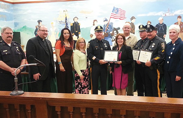 Members of the PAPD being honored 5/11/2016 (L to R) Deputy Police Chief Larry Cattano, Police Chaplains, A Resident received help from Police, Pastor Bernadette Falcon-Lopez, Lt. Paul Cannamela, Mayor Diaz, Police Chaplain Gregory Pabon, Capt. Roman McKeon, Officer Willie Lopez. There was communication stating Pastor Bernadette Falcon-Lopez of God’s Army Ministries of NJ commending the following Police Officers for not only doing their job daily to protect and serve, but also for going above and beyond the call of duty through an act of charity they perform during the annual Point-In-Time survey. Besides the Officers above, Officer Henry Rodgers and Lt. Steven Killane (not pictured above) were also commended.