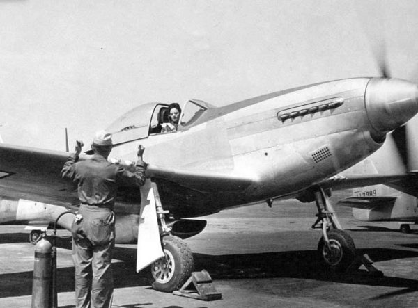 Florene Watson preparing a P-51D-5NA for a ferry flight from the factory at Inglewood, California. Wikipedia.com.