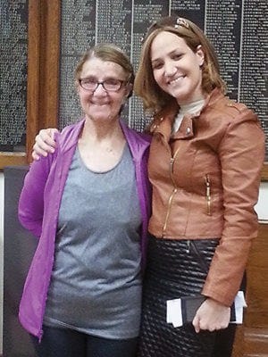 Elizebeth Farkas (L) daughter of Holocaust Survivor Alan Farkas poses with Frieda Mehrel (R) whose grandfather was in the same Concentration Camp (Bergen-Belsen) with Anne Frank. Anne Frank died there in Feb. 1945, at the age of 15.
