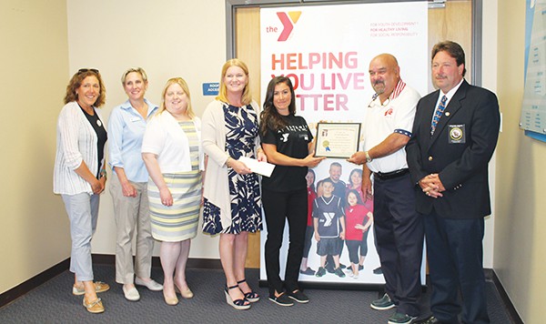 SOUTH AMBOY - The Livestrong wellness program is designed for cancer survivors and those fighting cancer, on a daily basis. The program provides a certified wellness trainer that works with each individual on the level of their physical strength and keeps an accurate record of each individual. to show how they are improving, so they can progress to a healthy life style through exercise and stretching. In the photo. L-R is Rose Cushing, CEO, YMCA of Metuchen, Edison, Woodbridge and South Amboy. Lisa Sanguiliano, District Executive Director. Nicole Miller, Membership Marketing Director. Beth Helsby, Director of Operations South Amboy Y. Ashley Malone, Wellness Coordinator. Val Tarr Chairman of South Amboy Elks Nation Foundation. And Mike Green, Exalted ruler of South Amboy Elks.