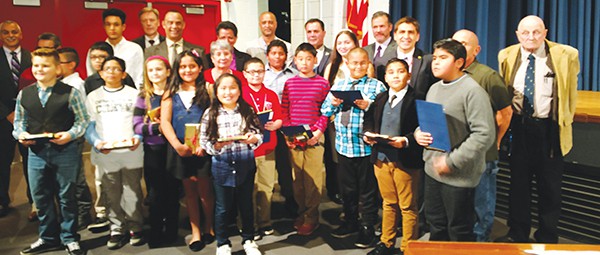 Students who achieved a perfect score on the Science PARCC & NJASK were given recognition by Dr. Damian Medina. Here they pose for a group photo with the Board of Education, Superintendent Dr. David Roman, Assistant Superintendent Mr. Richard Chromey, Board Secretary Derek Jess and Dr. Damian Medina at the 11/17/16 BOE Meeting *Photo by Katherine Massopust