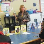 Teacher Linda Bozzo uses a slide show to teach parents how to help their young children to have appropriate reading skills by the time they reach 3rd Grade