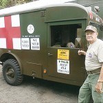 Jack White, Korean War Veteran and member of the “Military Transport Assn.”, stands buy his fully restored 1968 Jeep Ambulance. The ambulance saw service for 10 years in Vietnam.