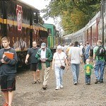 Visitors walk between the many trains on display.