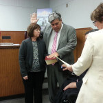 Mickey Gross is sworn in by Middlesex Co. Surrogate Kevin Hoagland. Gross’ wife, Sue hold the bible.