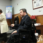 Middlesex County Surrogate Kevin Hoagland watches as Christine Noble signs the certificate after she was sworn in.