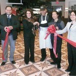 Ceremonial cutting of the red ribbon. Pictured (L to R), Mayor’s Aide Irving Lozada, Mayor Wilda Diaz, Hong Lu, Tom Lu, and BID/UEZ Coordinator Roxana Troche