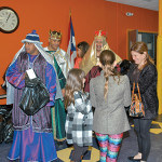The Three Kings hand out Gifts to Children