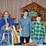 Reverend Father Angelo J. Michaels of St. Demetrios Greek Orthodox Church of Perth Amboy, Zachary Giannakopoulos and his brother, Dean Giannakopoulos