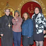 Rev. Father Angelo J. Michaels, Carolyn Maxwell, holding the coin of the Vasilopita. The Greek word Vasilopita is directly translated as “Sweet Bread of Basil.” When the bread is prepared, a coin is baked into the ingredients. Sweet flavoring is added to the bread which symbolize the sweetness and joy of life everlasting. It also symbolizes the hope that the New Year will be filled with the sweetness of life, liberty, health, and happiness for all who participate in the Vasilopita Observance. Stella Wacker and Honorable Marina Corodemus Parish Council President.