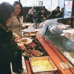 Mayor Diaz samples the cuisine with Roxana Troche
