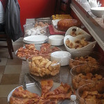 An array of pastries and one of the popular pizzas on the menu.
