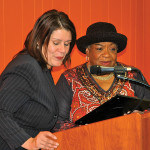 Mayor Wilda Diaz reads a proclamation of thanks from the City to Dot