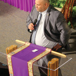 (L) Ken Ortiz , Head of the Dept. of Recreation (R) and one of the members of the Clergy reflected on the life of Richard Pryce