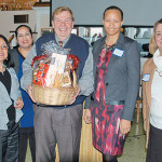 UEZ Coordinator Roxana Troche, Yolanda Flores, Dan Henrickson who won the gift basket, Business Administrators Jillian Barrick and Camille Tooker