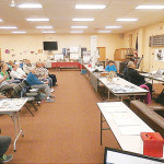 The Audience listens attentively to Joanne Rajoppi.